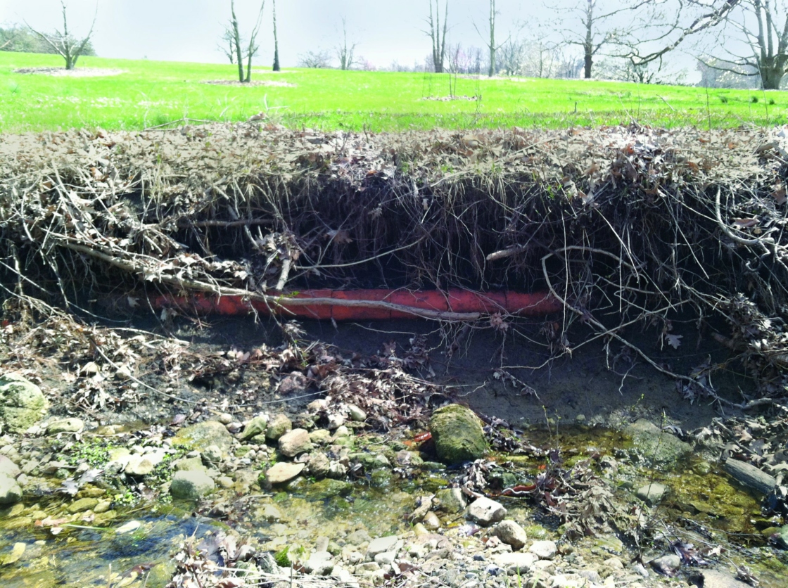Drain tile being dug up