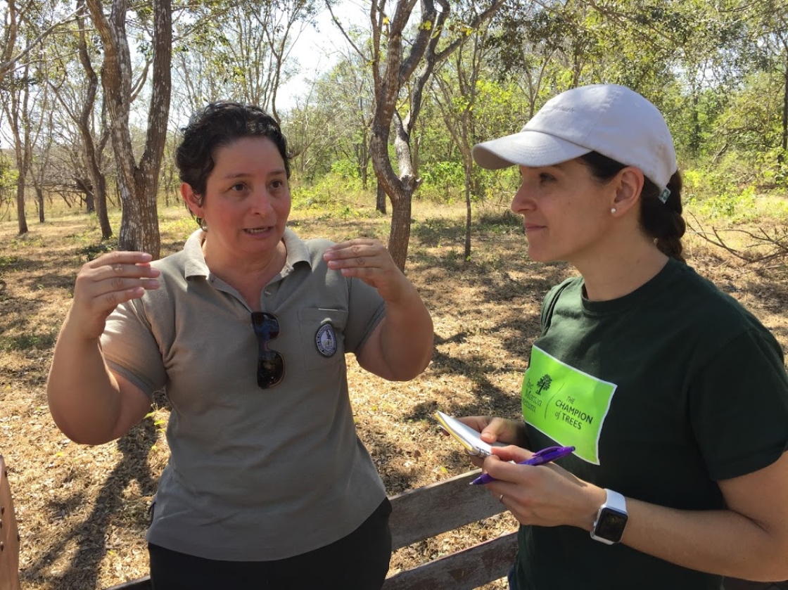 Two members of Oak of the Americas Conservation Network discussing conservation outside