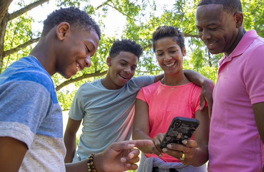 Family looking at a map on their phone