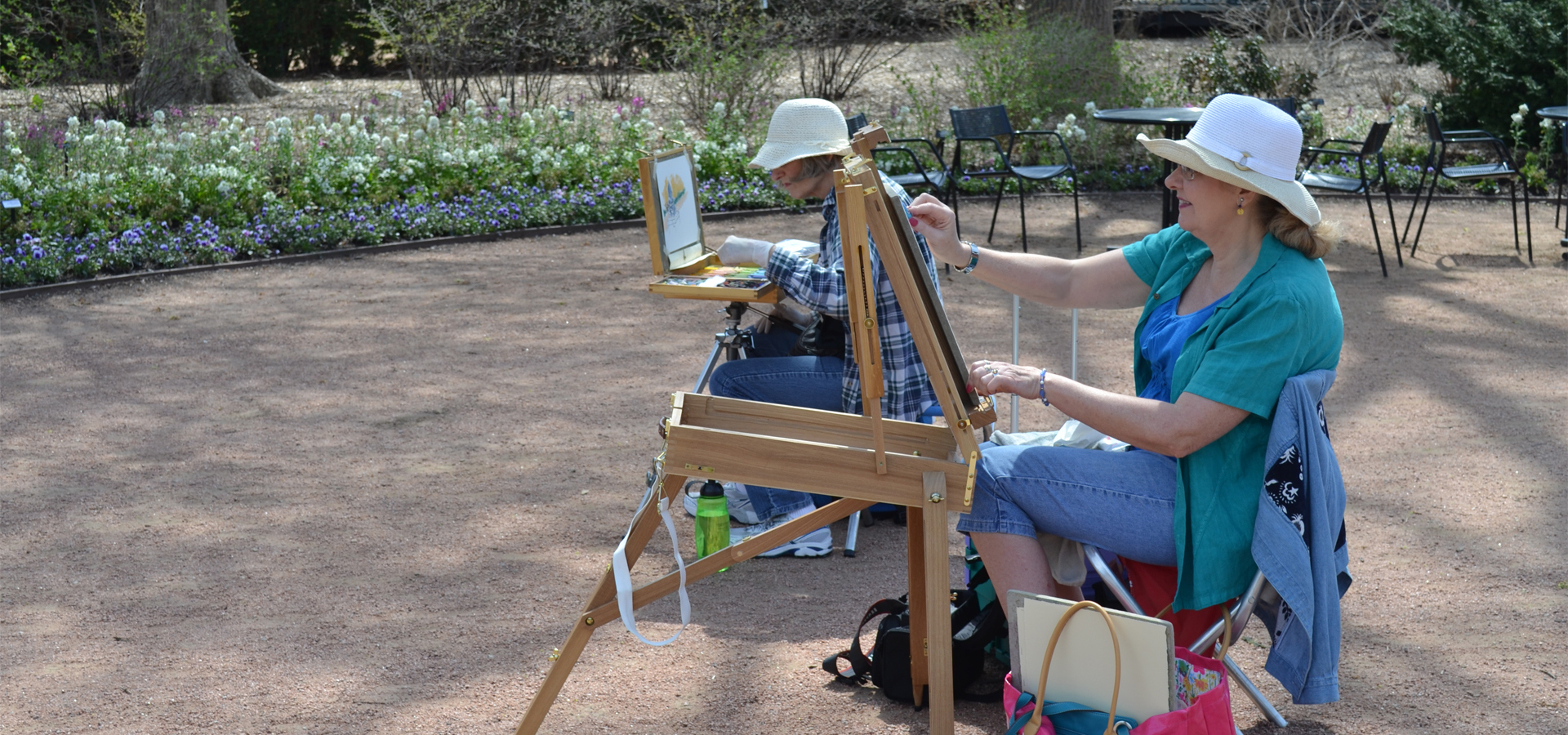 Artists painting in arbor court in spring