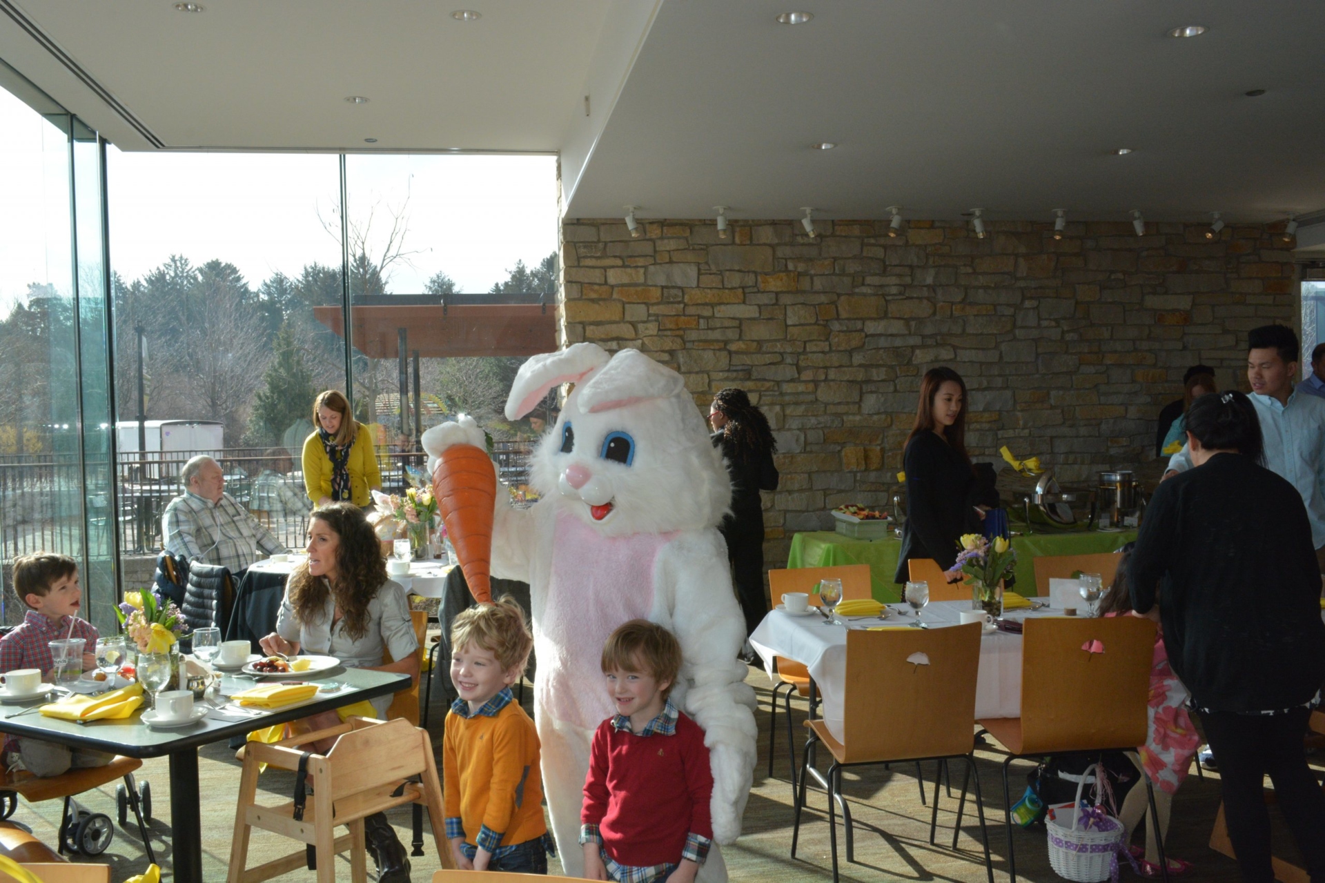 Easter bunny poses with children at easter brunch