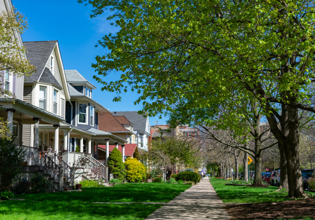 Sidewalk with homes and street trees