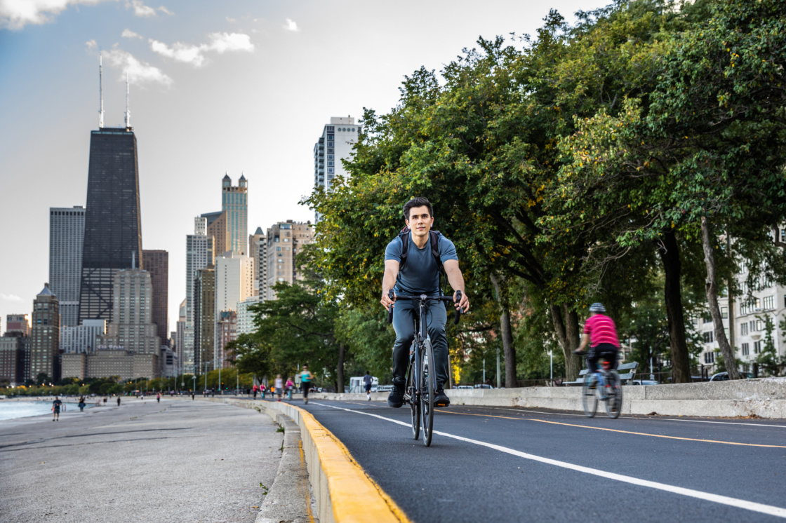 People biking on Lakeshore Drive in Chicago near trees