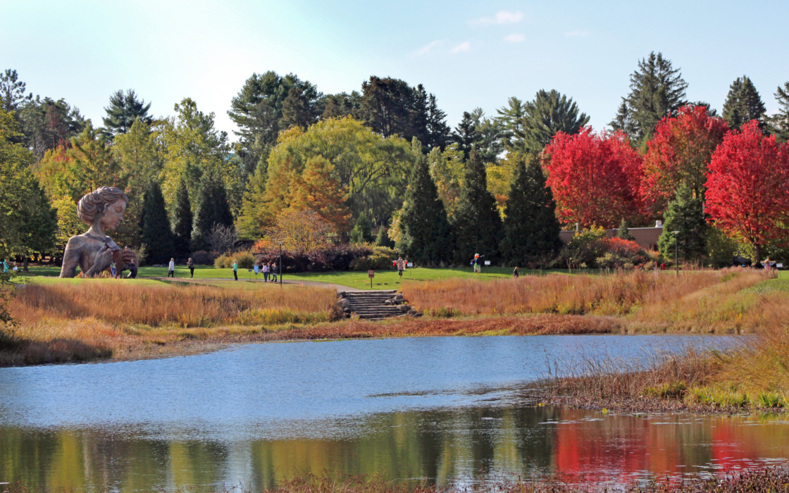 Human+Nature sculpture Hallow view from across Meadow Lake in Fall