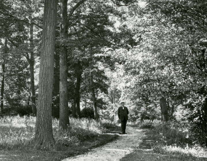 Black and white image of Joy Morton walking on Joy Path