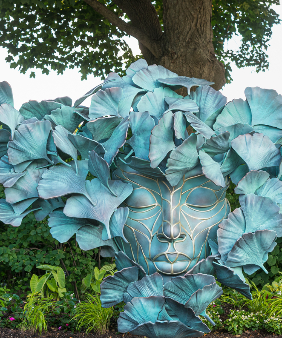 Ginkgo Human Nature sculpture in Arbor Court with plantings around it