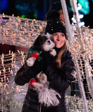 A guest enjoys Illumination with her dog