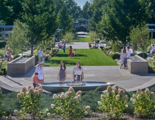 Guests look at the fountain in the Celebration Garden