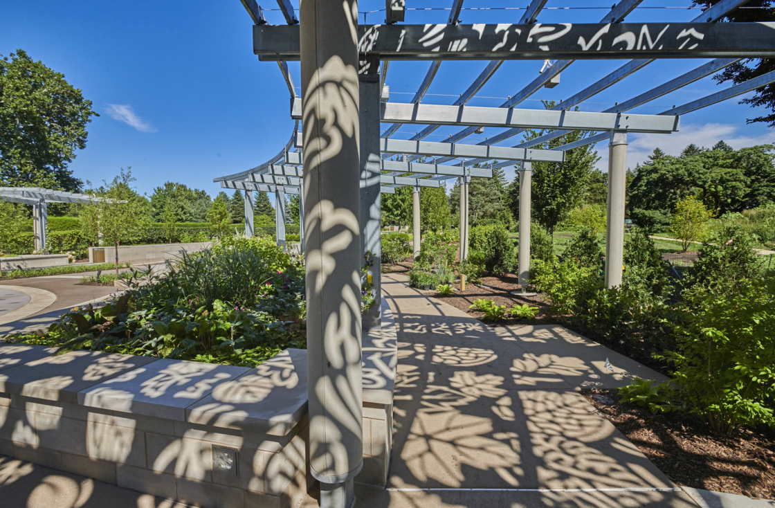 Arbors in Centennial Plaza casting leaf pattern shadows