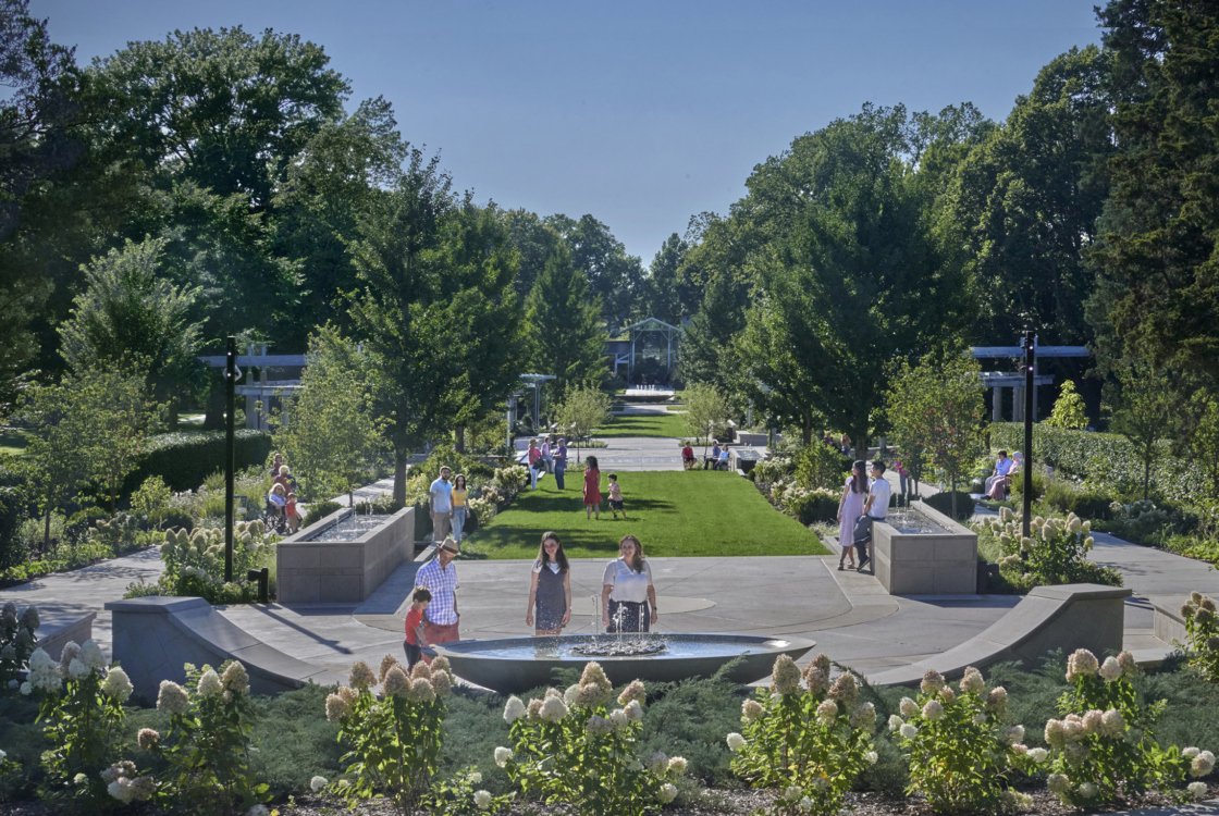 Guests look at the fountain in the Celebration Garden
