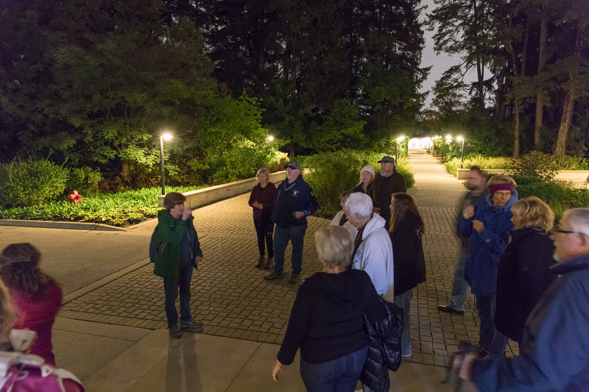 A group getting ready to take a hike at night at the Arboretum