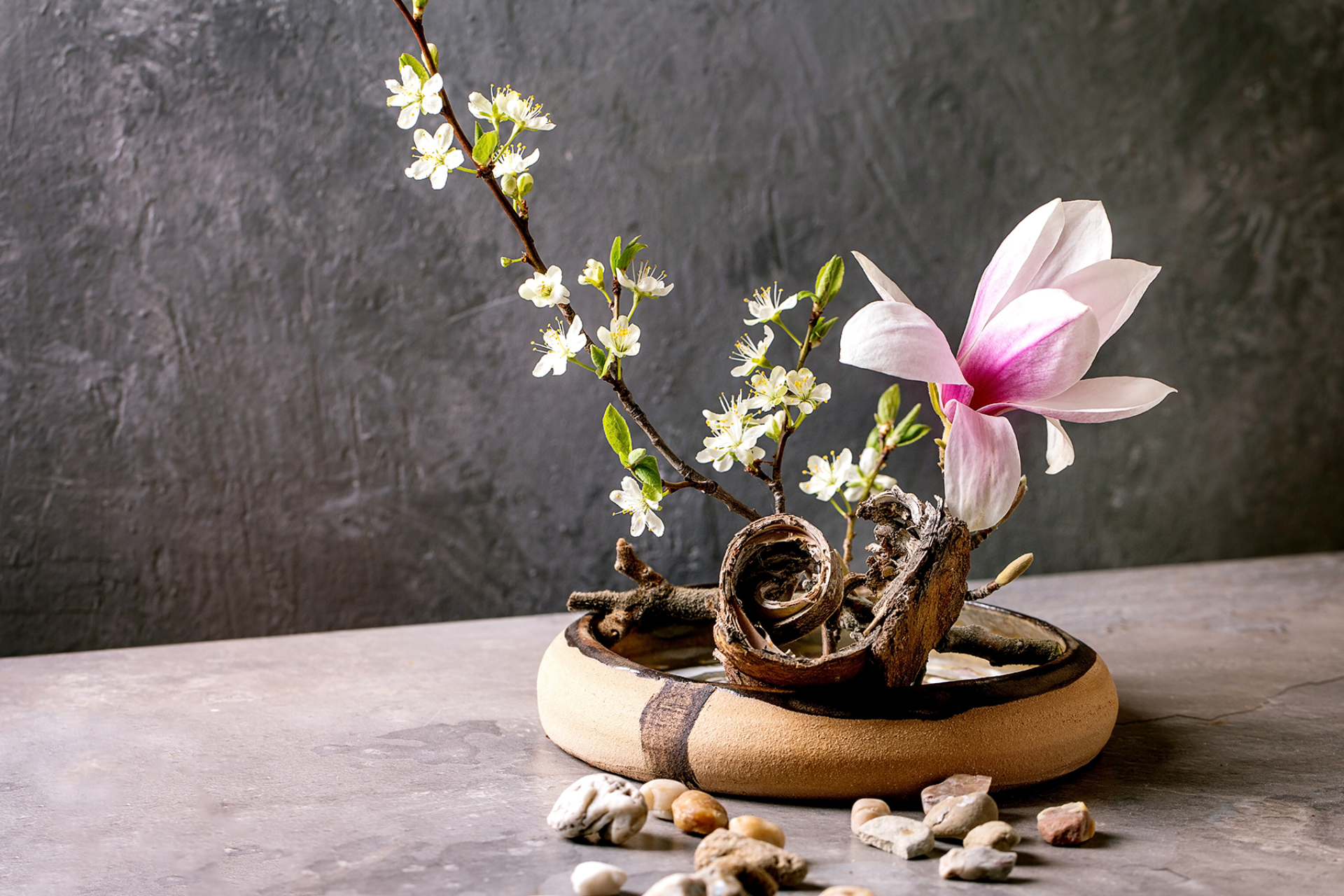 A Japanese flower arrangement featuring spring blooms.