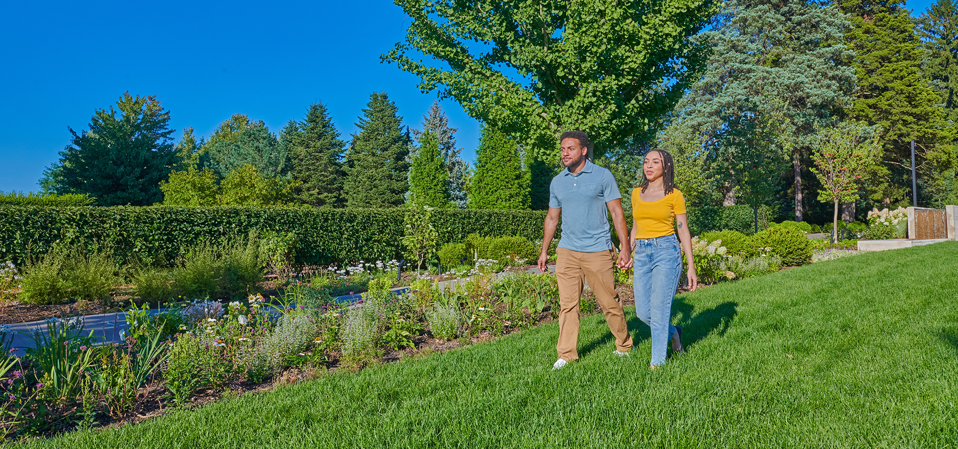 Photograph of couple walking in The Gerard T. Donnelly Grand Garden at The Morton Arboretum