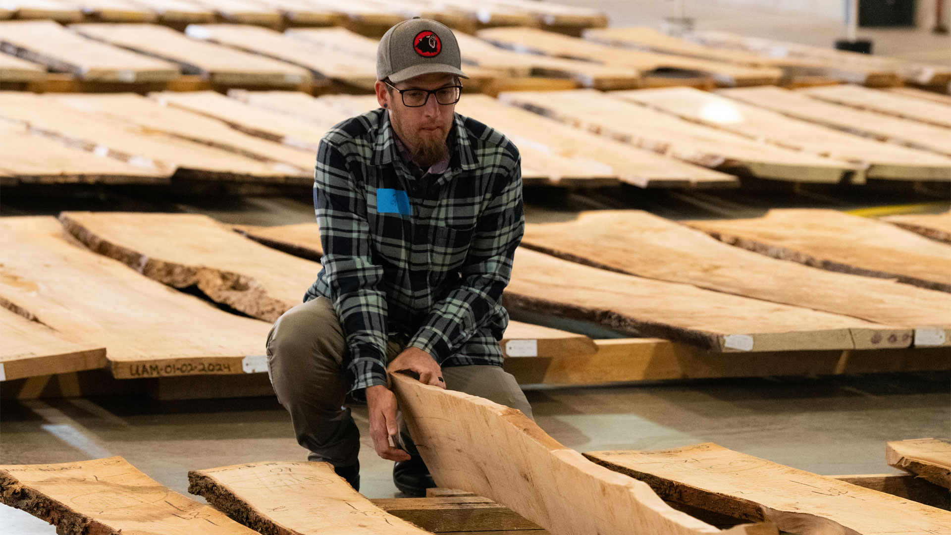 A member looks at slabs for sale at the arboretum