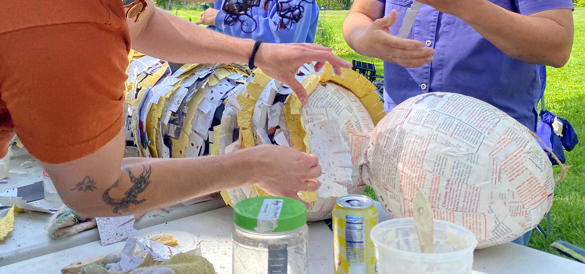 A photo of a group making a pinata out of seed paper