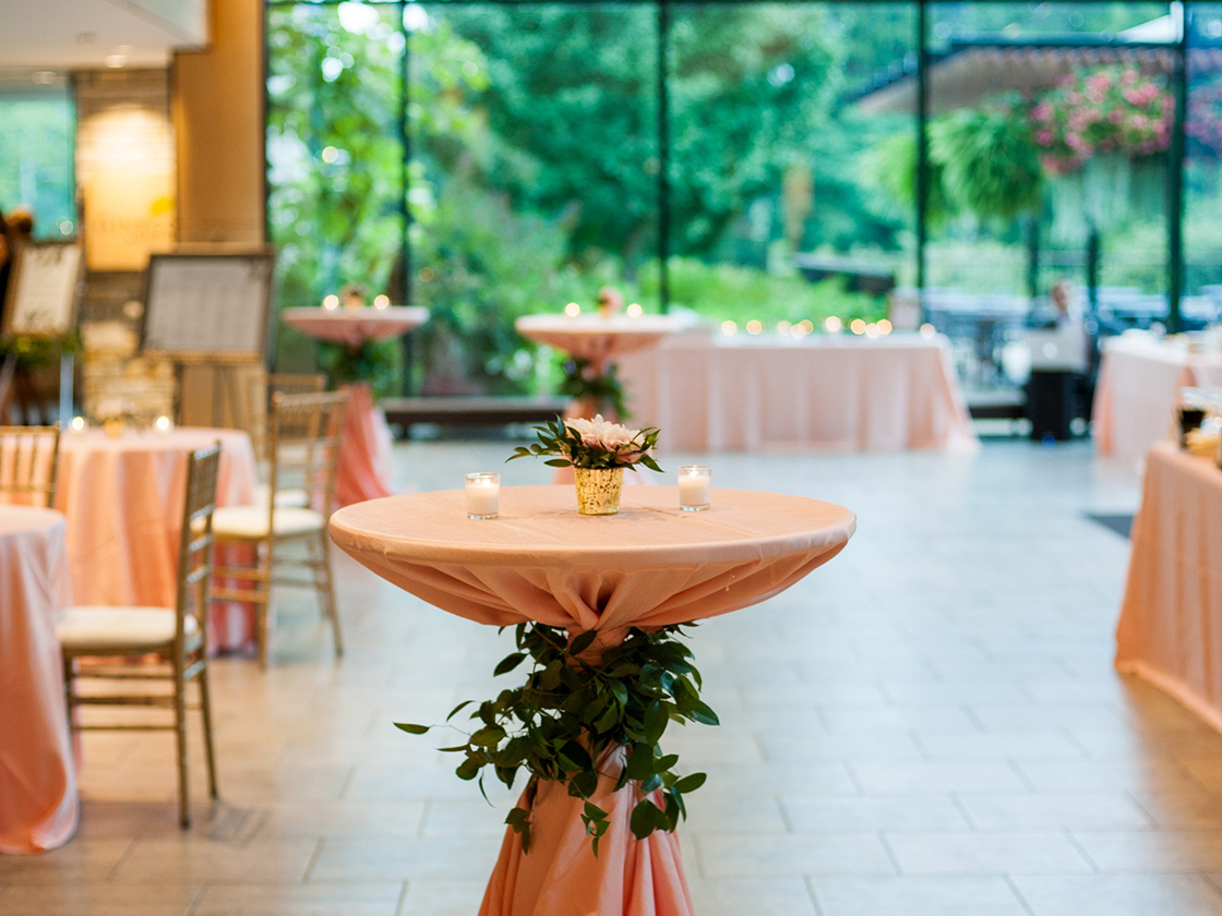 Cocktail table with decorative greenery in the Orientation Gallery