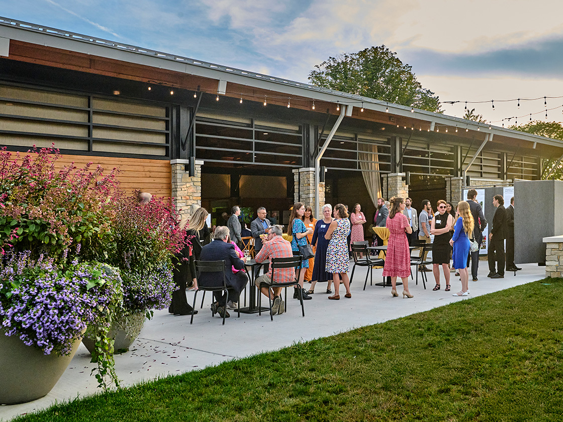 Wedding guests socializing on the Firefly Pavilion patio