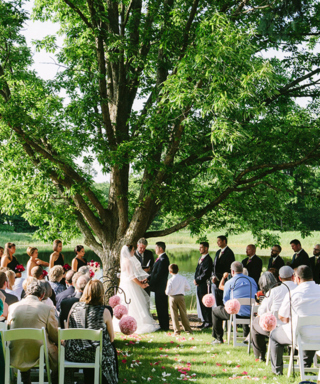 Wedding ceremony in front of large tree at The Morton Arboretum