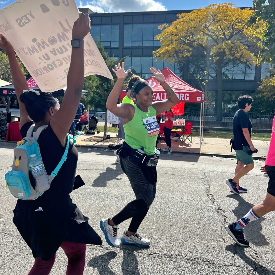 Runner in Team Morton Arboretum tank top celebrating