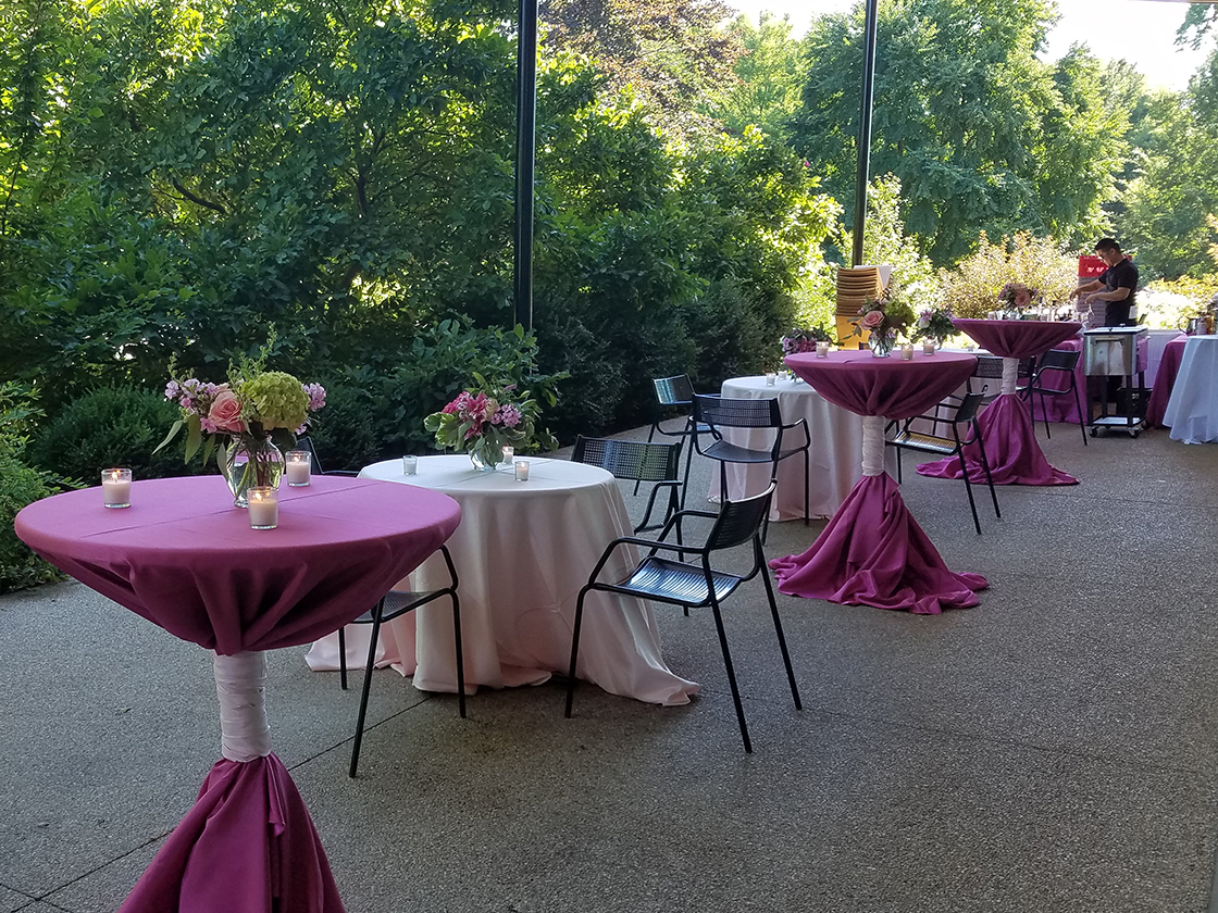 Cocktail tables set for a private event on the Sycamore Patio