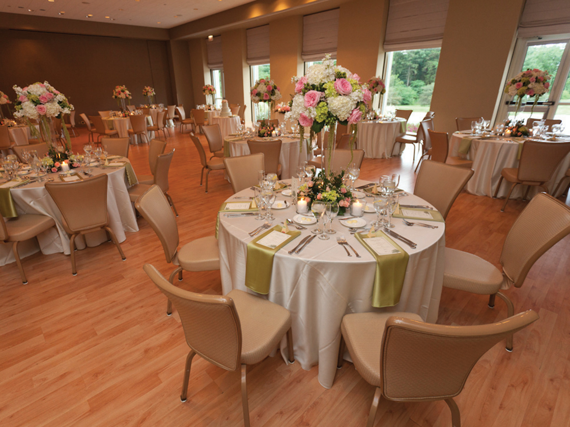 Dinner table with candles in the Arbor Room