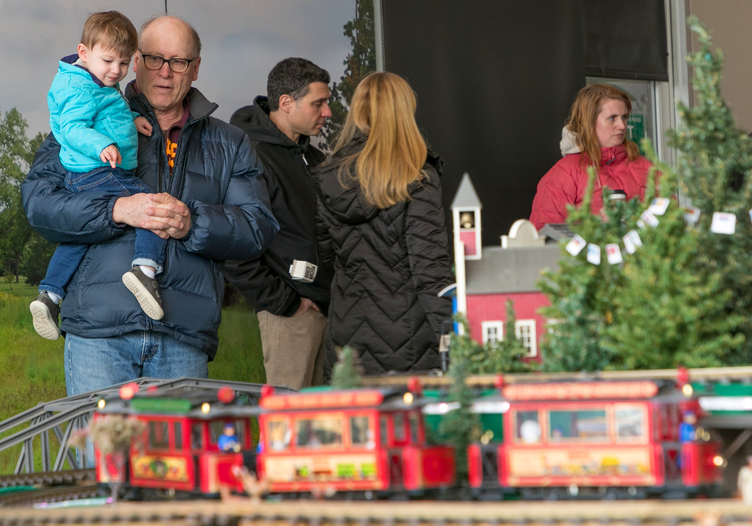 Photograph of visitors enjoying a model train event at The Morton Arboretum