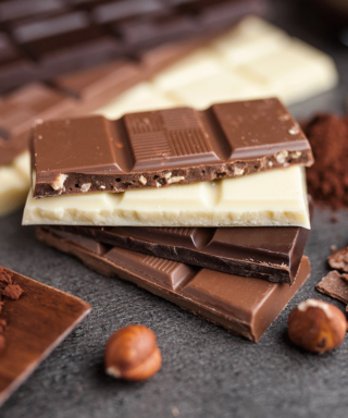Photograph of different kinds of chocolate bars stacked on top of each other