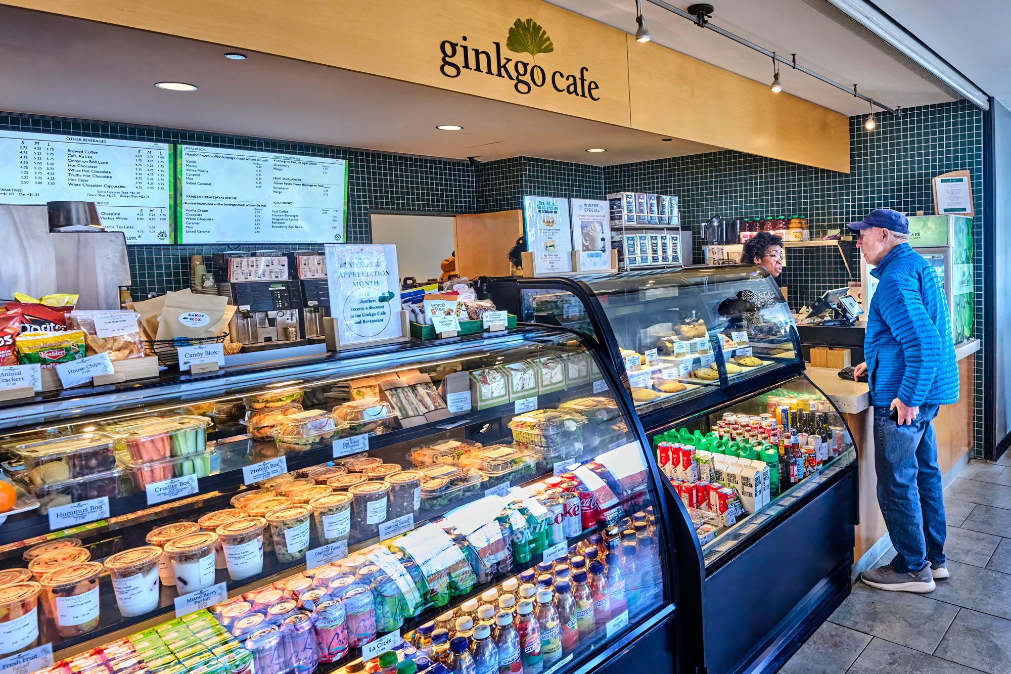 A guest orders a coffee from the Ginkgo Cafe in the Visitor Center.