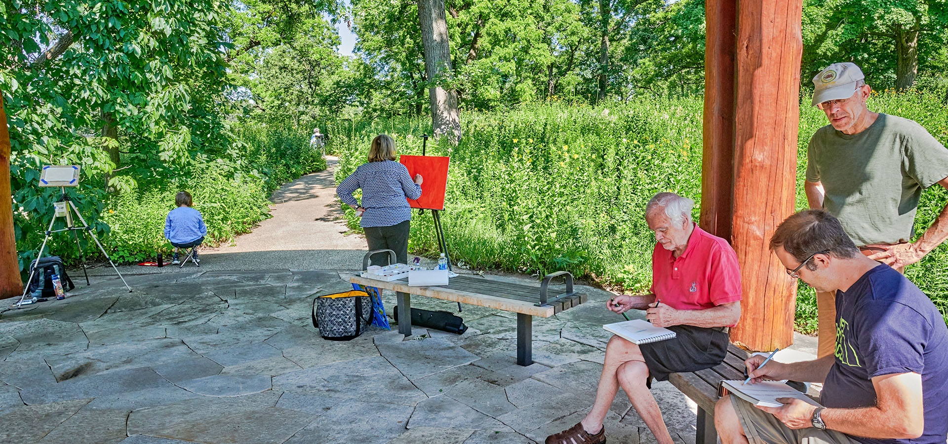 Photograph of visitors taking part in Plein Air drawing and painting at The Morton Arboretum's Schulenberg Prairie's Prairie Visitor Station