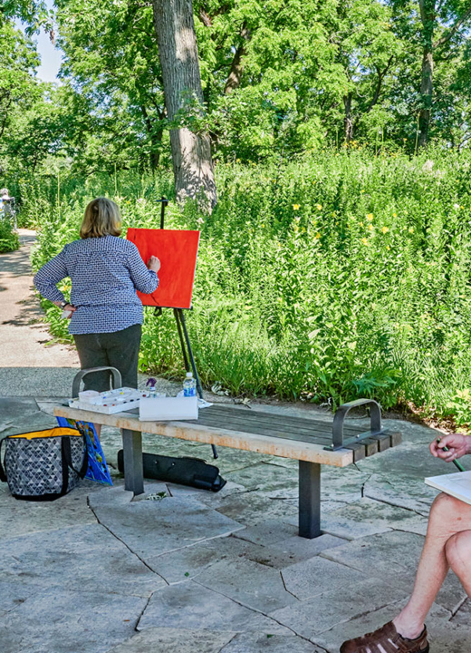 Photograph of visitors taking part in Plein Air drawing and painting at The Morton Arboretum's Schulenberg Prairie's Prairie Visitor Station