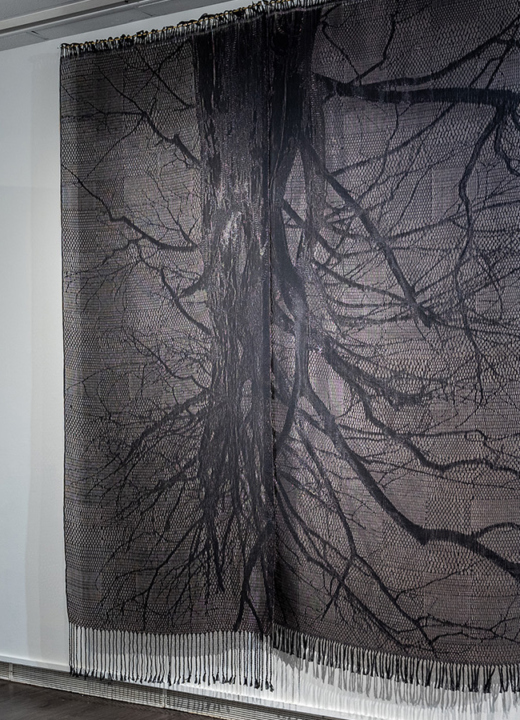 Photograph of an art gallery displaying Tali Weiberg's textile artwork