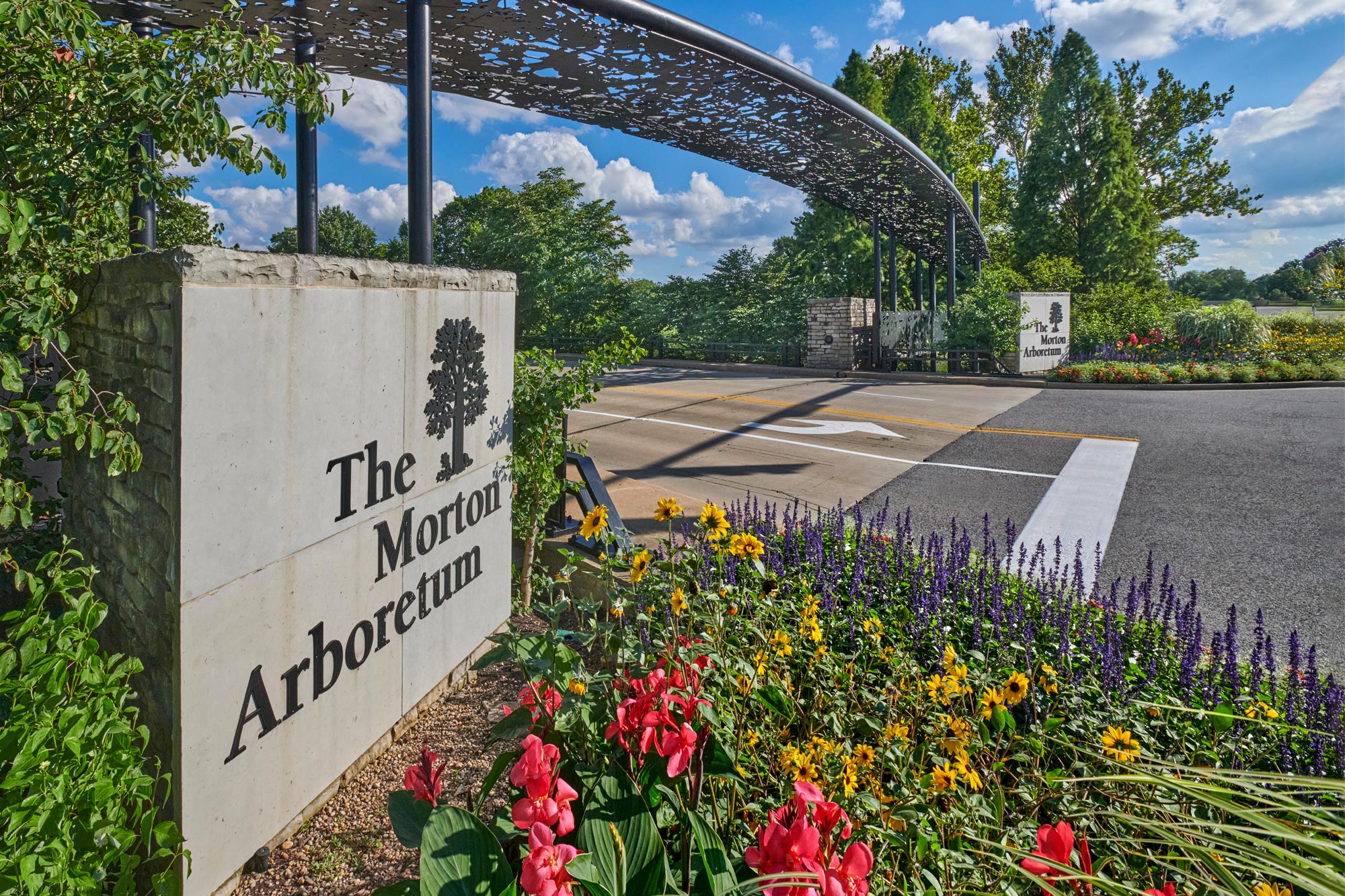 Photograph of the entrance sign to The Morton Arboretum from the road of IL Route 53