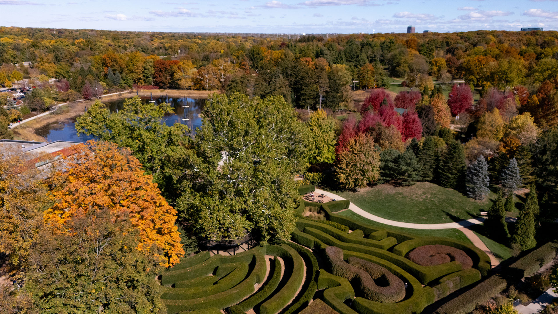 An aerial view over Meadow Lake and the maze garden in fall