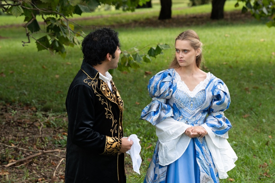 Actors portraying Katherine and Heathcliff have a serious conversation